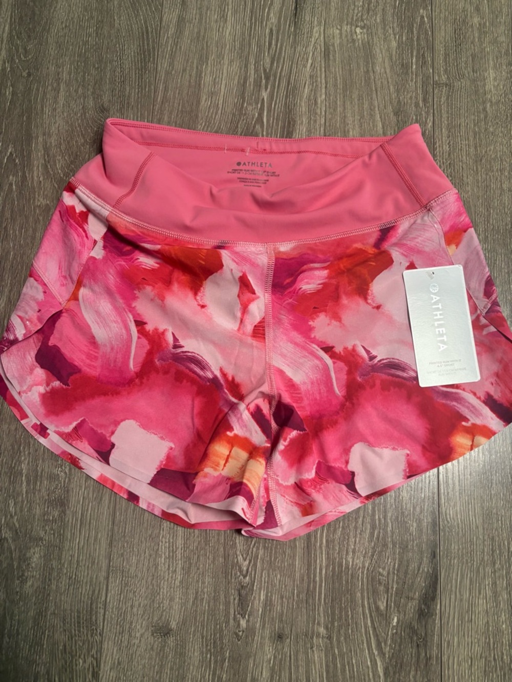 Athleta Run With It running shorts in the Painted Energy Coral pattern NWT